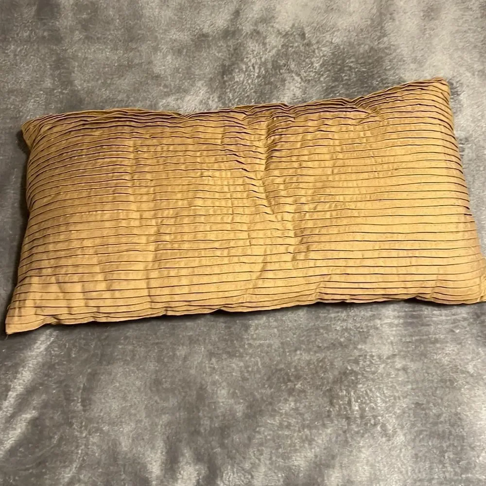 Tan/brown pillow. One side pleated/one side buttons